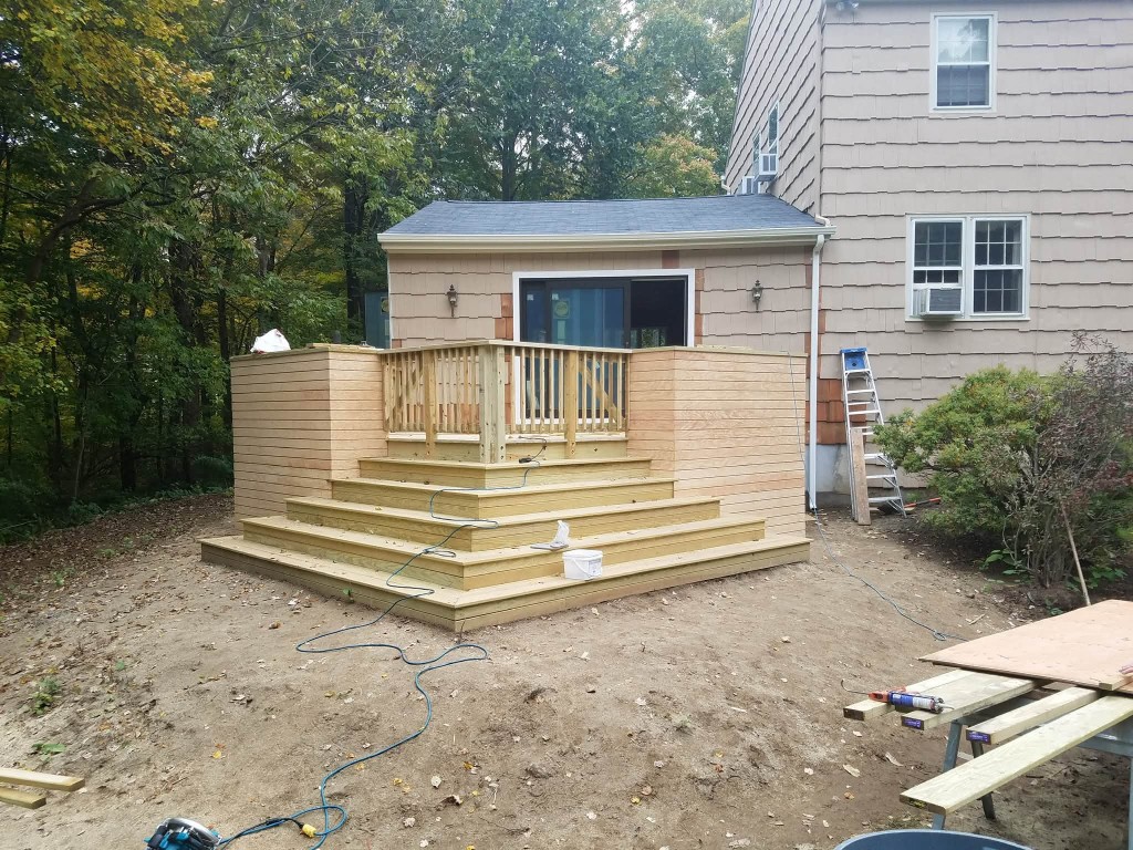 Custom wooden deck and wraparound stairs